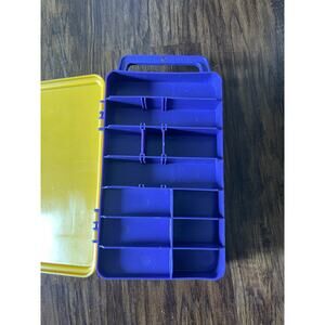 Plastic pink, blue and yellow tackle craft box